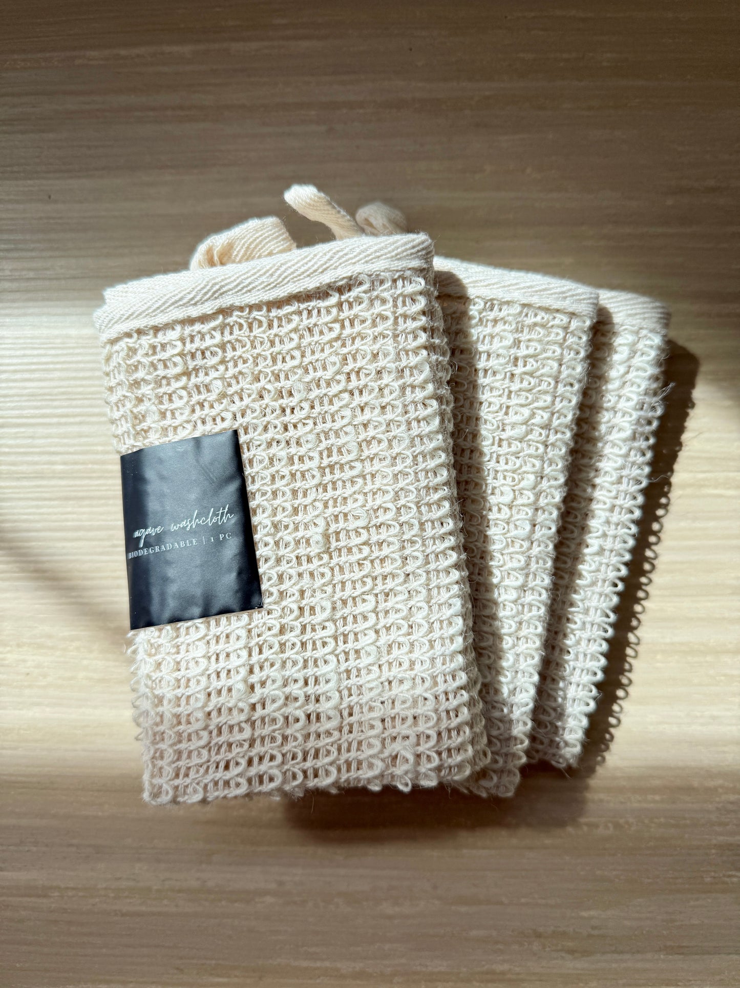 knitted handmade agave washcloth with label